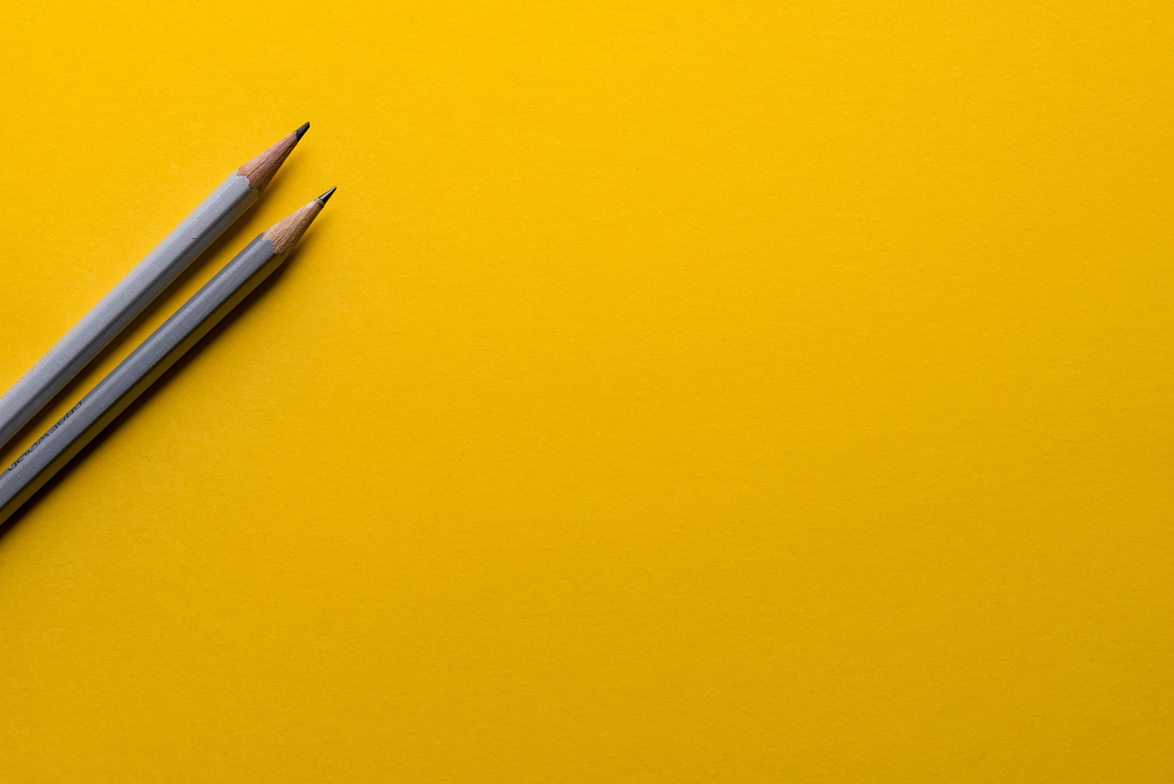 Pencils on a warm background representing education and opportunity